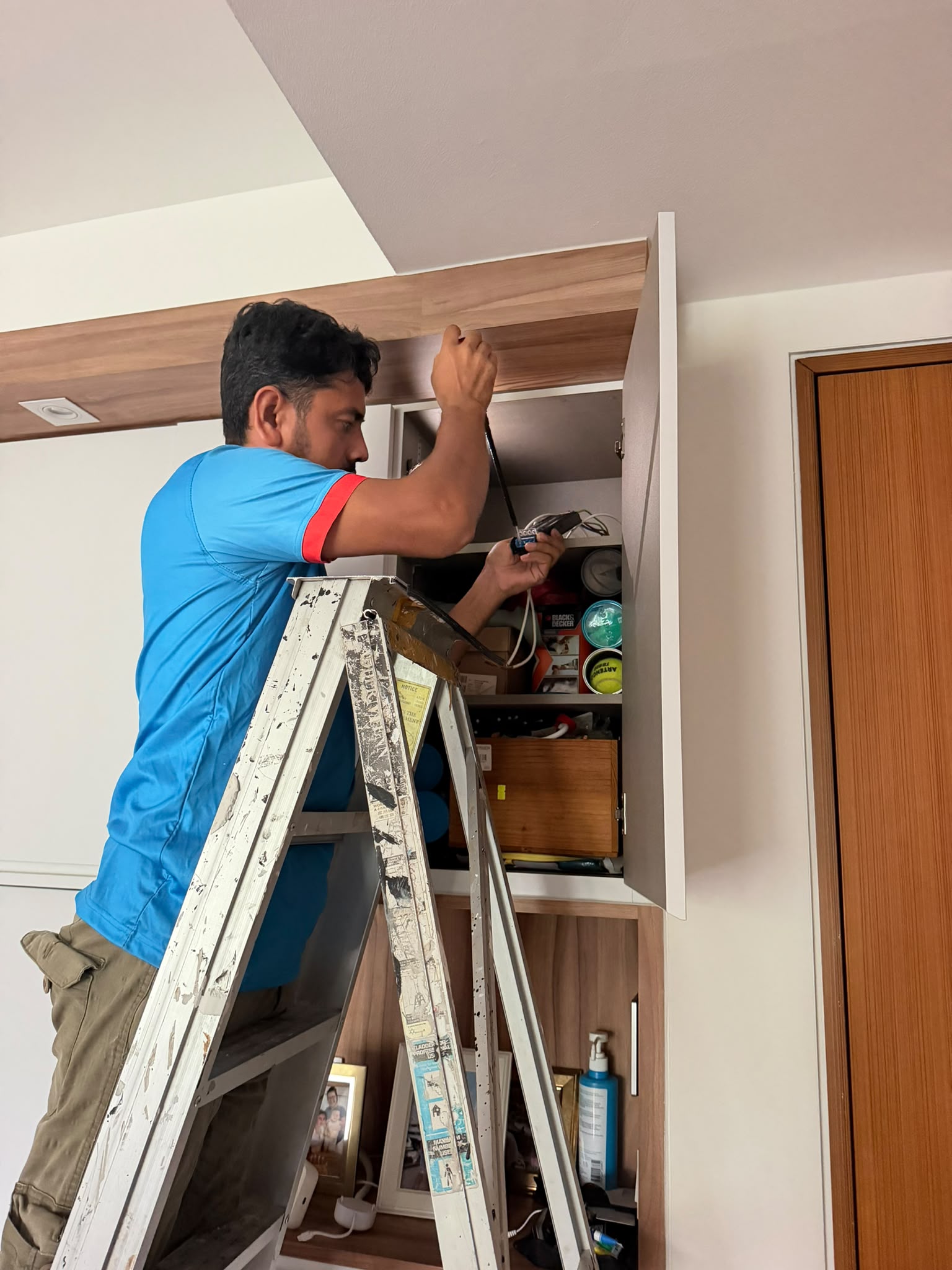 Professional electrician working on an electrical panel